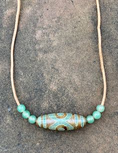 This one-of-a-kind necklace showcases the earthy beauty of Tibet Agate and Green Aventurine, strung on a durable leather cord for a rustic, organic look. The warm copper clasp adds a charming touch to the natural stone pairing, creating a harmonious blend of textures and tones. Perfect for those who appreciate unique, handcrafted jewelry with a bohemian flair. Earthy Beauty, Copper Choker, Textures And Tones, Jasper Necklace, Labradorite Necklaces, Handcrafted Necklace, Copper Necklace, Picture Jasper, Spiritual Healing