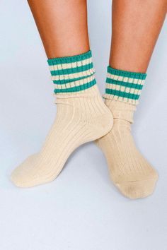 The Lexi is our mid-weight double-cylinder ankle featuring premium combed cotton knit with contrasting striping on an extended cuff. The thicker knit blend will keep your feet warm and steps soft. Size+ OSFA, W 6-10 Design+ 96 Needle+ Mid-weight+ Reinforced toe & heel+ Seamless toe+ Sweater knit+ Tall ankle Content + Care+ Premium Combed Cotton+ Wash Cold/Dry Low+ Imported Winter Sporty Socks With Ribbed Cuffs, Sporty Winter Socks With Ribbed Cuffs, Winter Cotton Socks With Ribbed Cuffs, Striped Cotton Socks For Winter, Cozy Mid-calf Spring Socks, Winter Striped Socks, Casual Hand-knitted Fitted Socks, Solid Color Mid-calf Ribbed Socks, Solid Color Ribbed Mid-calf Socks