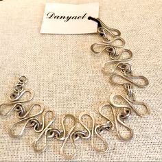 Intricate Handcrafted Style, Elegant S Design - Even The Hook Is Too Pretty To Hide! Great Gift - For You Or Someone Special! #Sterling #Handcrafted Jewelry Wire Jewelry Patterns, Jewellery Wire, Hardware Jewelry, Copper Wire Jewelry, Wire Jewelry Designs, Wrap Jewelry, Diy Wire Jewelry, Wire Work Jewelry, S Design