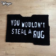 a rug with the words you wouldn't steal a rug written on it in white ink