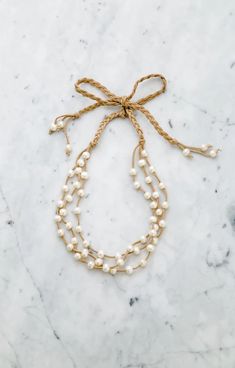 Triple strands Pearl & Leather Ribbon Necklace is Stephanos' signature necklace we all love. Timeless pearl necklace in style accomplishes your casual outfit and party dress. This beautiful day to night necklace is carefully hand-crafted with the quality pearl and love. #pearl #pearllover #triplepearls #bride #bridal #bridalshower #gift #handmade Night Necklace, Handmade Pearl Necklace, Leather Pearl Necklace, Signature Necklace, Ribbon Necklace, Jewelry Website, Simple Outfit, Pearl Leather, Fancy Jewelry