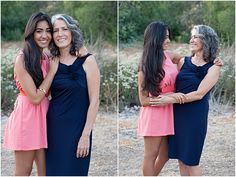 two women hugging each other in front of bushes