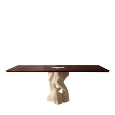 the table is made out of concrete and has a wooden top with an abstract design on it