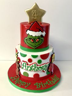 a three tiered cake decorated with an image of the grin face