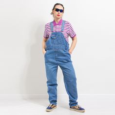 "Vintage denim overalls in blue - adjustable suspenders - two rows of buttons for adjusting the waist circumference - 5 pockets - materials: 100% cotton Size from the tag: L MEASUREMENTS bust: open waist: 40-45.5 inches (102-116 cm)  hips: 44 inches (112 cm) inseam: 32 inches (81 cm) The model is 5'9\" (174 cm), measures 35-27-38 (89-69-96 cm) and typically wears clothing in size M CONDITION - 8/10 - The overalls in good pre-owned vintage condition. Washed, ready to wear." Retro Medium Wash Denim Jumpsuit Overall, Retro Style Straight Leg Cotton Overalls, Retro Cotton Jeans With Bib Front, Retro Cotton Denim Jumpsuit With Bib Front, Retro Straight Leg Overalls With Pockets, Retro Spring Overalls With Bib Front, Retro Denim Jumpsuit With Bib Front, Retro Straight Leg Cotton Overalls, Retro Overalls With Pockets