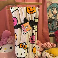 a hello kitty towel hanging on a clothes rack