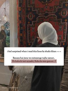 a woman standing in front of a rug and looking at something on the wall behind her