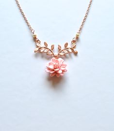 "2018 COLLECTION, a nature inspired necklace featuring blush Dahlia flower dangled on metal branch. If you prefer different color, please drop a note. Detail : - Hand sculpted Dahlia made of Polymer Clay . Size approx: 16-17mm. - Rose Gold plated over brass branch. - Cream Swarovski Pearls - Gold Plated over brass chain as pictured, silver plated, rose gold available. - Entire length 16\" + 2 extenders. - Handmade in The USA - Made to order in 3-4 business days. If you need earlier shipping date Rose Gold Nature-inspired Flower Pendant Necklace, Rose Gold Flower Pendant Necklace Nature-inspired, Rose Gold Flower Pendant Necklace, Nature-inspired, Rose Gold Flower Pendant Necklace, Delicate Rose Gold Flower Necklace With Adjustable Chain, Feminine Rose Gold Necklace With Flower Charm, Rose Gold Flower Necklace With Adjustable Chain, Nature-inspired Rose Gold Necklace, Delicate Pink Pendant Flower Necklace