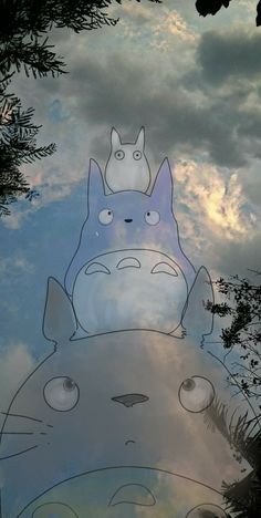 an image of the sky and clouds with totoro on it's back