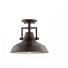 an industrial style light fixture with a metal shade on the top, and a white background