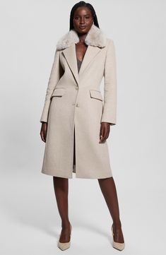 A wool-kissed staple coat gives you the option to push up the plush factor by adding a faux fur collar whenever it suits your mood. Front button closure Notched collar with removable faux fur Three-button cuffs Front flap pockets Back belt Back vent Lined 39% polyester, 35% recycled polyester, 18% wool, 3% viscose, 3% acrylic, 1% cotton, 1% polyamide with 100% polyester faux fur Hand wash, dry flat Imported Chic Beige Wool Fur Coat, Long Wool Coat With Faux Fur Trim For Work, Workwear Long Wool Coat With Faux Fur Trim, Chic Wool Fur Coat With Faux Fur Trim, Chic Long Wool Coat With Faux Fur Trim, Beige Wool Outerwear With Faux Fur Trim, Wool Fur Coat With Faux Fur Trim For Work, Chic Wool Coat With Faux Fur Trim For Work, Chic Winter Coat