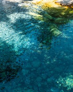 the water is crystal blue and clear with little bubbles in it's bottom layer