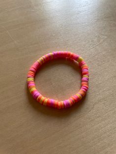 a bracelet with neon colors! ⚡️ Trendy Pink Friendship Bracelets For Festival, Trendy Multicolor Round Stretch Bracelet, Trendy Red Stretch Bracelet For The Beach, Trendy Red Stretch Bracelet For Beach, Trendy Rainbow Bracelet For The Beach, Trendy Rainbow Bracelet For Beach, Trendy Neon Bracelets As Gift, Trendy Neon Bracelets For Gifts, Trendy Neon Jewelry