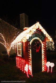 a house decorated with christmas lights and candy canes