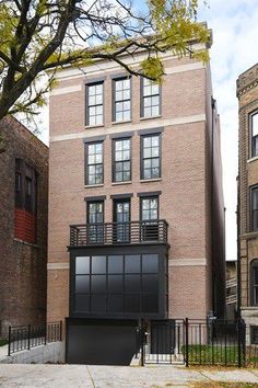 an apartment building with several windows and balconies