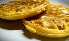 two waffles sitting on top of a white plate