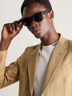 Cutler and Gross' '9261' sunglasses are a fresh interpretation of classic Americana styles from the '50s. They're made from thick tortoiseshell acetate that's polished over the course of nearly 100 hours to create its glossy finish. Classic Wayfarer Sunglasses For Business, Classic Polarized Sunglasses For Business, Classic Mirrored Sunglasses For Business, Classic Acetate Sunglasses For Formal Occasions, Modern Tortoiseshell Sunglasses For Formal Occasions, Modern Tinted Sunglasses For Work, Classic Sunglasses With Gradient Lenses For Work, Classic Tortoiseshell Wayfarer Sunglasses, Ralph Lauren Blazer