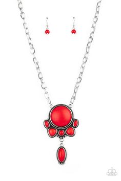 A large red stone encased in a studded silver frame swings dramatically from a heavy silver chain with oversized links. A collection of red stones wraps around the bottom of the large pendant, with an elongated oval stone swaying below them. Features an adjustable clasp closure. Red Necklaces, Red Stone Necklace, Elongated Oval, Red Stones, Stone Wrapping, Red Necklace, Ball Necklace, Paparazzi Accessories, Oval Stone