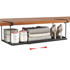 a shelf with two pairs of shoes on it and some other items in front of it