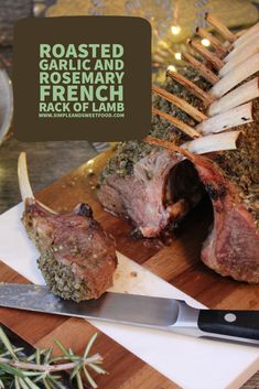 roasted garlic and rosemary french rack of lamb on cutting board with knife next to it