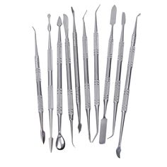 dental instruments are arranged in a row on a white background