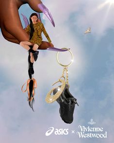 a woman sitting on top of a pair of shoes hanging from a keychain