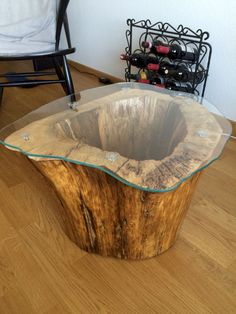 a wooden table with glass top on the floor