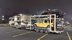 a yellow jeep towing a trailer with a camper on it's back in a parking lot