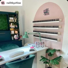 a room with a desk, chair and shelf filled with nail polish bottles on it