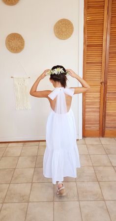 "Beautiful white dress for girls, perfect for flower girls dress in. Made with breathable fabric in 100% natural cotton. Perfect for beach wedding, destination wedding, boho wedding. This backless dress is so adorable and elegant at the same. Featuring backless top with a soft tulle long strap that you tie in a big bow that offers this timeless and delicate detail. Flared skirt that your flower girls will love twirling and dancing into. Elastic back waist for comfort and room for growth. Bodice Girl Boho Dress, Beach Wedding Flower Girl, Beach Flower Girl Dresses, Flower Girl Dress White, Girls Boho Dress, Beach Wedding Destination, Girl Dress White, Flower Girls Dress, Beautiful White Dress