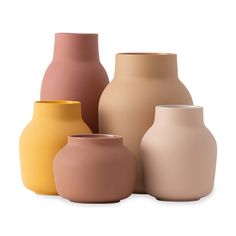 several different colored vases sitting next to each other