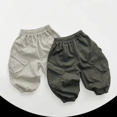 Upgrade your little one's wardrobe with our Children's Solid Cargo Pants. Made from soft and breathable cotton, these pants provide ultimate comfort for your child. The loose fit allows for easy movement, while the elastic waist ensures a secure and adjustable fit. With their trendy harem style and convenient pockets, these pants are both fashionable and functional. Suitable for both boys and girls, these solid-colored pants are a versatile addition to any outfit. Perfect for spring and autumn, 3rd Baby, Colored Pants, 2nd Baby, Outfit Style, Baby Grows, Skin Protection, Jogger Pants, Fashion Pants, Light Gray