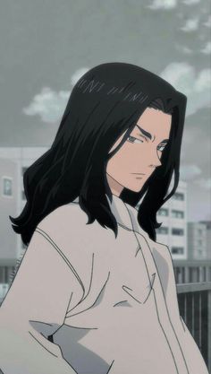 a man with long black hair standing in front of a cityscape and looking off into the distance