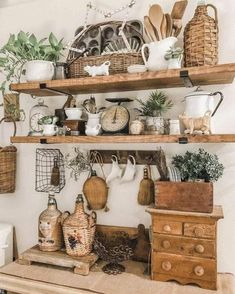 the shelves are filled with pots, pans and other kitchen utensil items