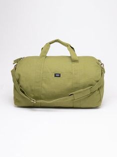 Nothing beats the simplicity and functionality of a good duffle bag—except maybe our Bumi Eco Duffel Bag, made with the good of the environment and people in mind! The perfect size for a spontaneous weekend getaway or when you need a little more room to haul daily gear for work or athletics.  Bag: 13"(H) x 20"(W) x 12"(D) Made with 12 to 14 oz Certified Fairtrade Organic cotton canvas Approximately 56L capacity Main compartment zippers with long pulls Internal zippered hanging pocket sized 9” (H Casual Bags With Adjustable Strap For Overnight Trips, Casual Shoulder Bag For Overnight Trips With Adjustable Strap, Casual Shoulder Bag With Adjustable Strap For Overnight Trips, Practical Solid Color Travel Bags, Practical Duffle Bag Tote With Pockets, Practical Tote Duffle Bag For Overnight Trips, Casual Luggage With Adjustable Strap For Overnight Trips, Green Casual Duffle Bag With Luggage Sleeve, Casual Rectangular Weekender Bag For Outdoor Activities