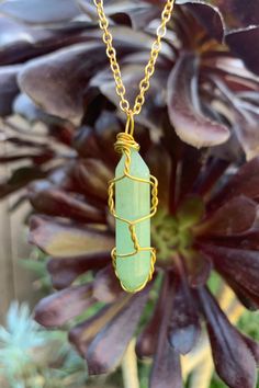 "Beautiful gold wire wrapped green Aventurine crystal point pendant on gold plated chain with lobster claw closure. The pendant is approximately 1.2\" long and 0.4\" wide. Please note that all crystals are unique and therefore color, shape and size may vary slightly. Please choose a necklace length from the drop-down menu. In case you would like a length other than the listed options, leave us a note at checkout. Item will be shipped 1 - 2 business days after purchase. \"Green Aventurine is know Gold Jade Gemstone Crystal Necklace, Gold Jade Crystal Necklace With Gemstone, Gold Aventurine Necklaces For Healing, Handmade Gold Crystal Necklace For May Birthstone, Gold Jade Crystal Necklaces As Gifts, Gold Jade Crystal Necklace As Gift, Gold Jade Crystal Necklace Gift, Green Hand Wrapped Crystal Necklace Gift, Green Hand Wrapped Crystal Necklace For Gift