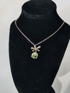 "This is a beautiful necklace and would make a wonderful gift! The peridot piece is approximately 1/4\" in diameter." Green Cross Pendant Necklace As Gift, Green Peridot Pendant Necklace, Green Peridot Necklace For Gift, Green Round Pendant Necklace With Lobster Clasp, Green Sterling Silver Necklace With Flower Pendant, Peridot Necklace With Round Pendant For Gift, Green Sterling Silver Pendant Crystal Necklace, Handmade Green Peridot Necklaces, Green Butterfly Pendant Necklace