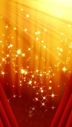 an abstract red and gold background with stars