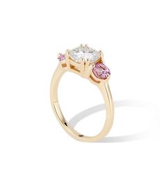 Gorgeous Cushion Cut Moissanite and Natural Pink Sapphire Engagement ring set in a high polish 14k yellow gold setting. 1.5 tcw Moissanite - Colorless DEF. Forever One Moissanite by Charles and Colvard - 7mm .70 tcw natural pink sapphire Hidden Amethyst on the inside - Can be changed for a personal choice. Handcrafted in NYC by our team of master jewelers. Size 6.5 in stock. Can be sized from size 5.5 -7. Free Global Shipping FINAL SALE Yellow Gold Sapphire Ring With Vs Clarity Round Cut, Yellow Gold Sapphire Ring With Brilliant Cut For Proposal, Yellow Gold Moissanite Sapphire Ring, Yellow Gold Sapphire Ring With Moissanite, Yellow Gold Moissanite Sapphire Ring With Round Cut, Yellow Gold Round Cut Sapphire Ring For Proposal, Yellow Gold Sapphire Ring For Proposal, Sapphire Engagement Ring Set, Pink Sapphire Ring Engagement