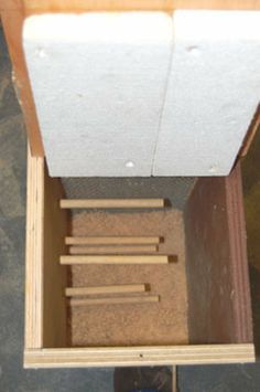 an overhead view of a wooden box with several pieces of wood sticking out of it