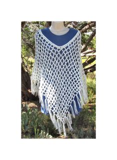 Hand crocheted Soft White boho style poncho. Open Mesh weave for a light poncho perfect for cool summer nights. Created using Red Heart Super Saver acrylic yarn in the "Soft White" colorway. One size fits most (up to 2X). Bohemian Handwoven Poncho For Festival, Bohemian Handwoven One-size Cape, Bohemian One-size Handwoven Cape, Hand Knitted Bohemian Poncho For Beach, Bohemian Hand Knitted Poncho For Beach, Bohemian Knitted Poncho For Spring, One Size Knitted Poncho For The Beach, Bohemian Summer Cape One Size, Bohemian One-size Cape For Summer