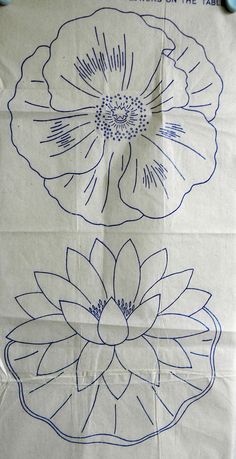 the paper has been drawn with blue ink on it and is next to an image of a flower