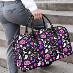 My hand drawn and original character illustrations make this spooky gothic Halloween patterned Faux Leather travel bag the perfect spooky season accessory. Features my hand drawn illustrations of skulls, black cats, tombstones, moons, bats, ghosts, bones, Halloween candy,  and more. The perfect travel bag for your spooky season travels or for every day use. Shop all of my travel bags at the link below: https://www.etsy.com/shop/darlingghoul?ref=seller-platform-mcnav&section_id=26920607 --------- Black School Bag For Halloween, Purple School Bag For Halloween, Gothic Travel Bag For Halloween, Spooky Black Bags For Halloween, Spooky Black Halloween Bags, Black Large Capacity Bags For Halloween, Large Capacity Black Bag For Halloween, Purple Pastel Goth, Pink Purple Pastel