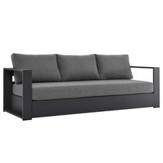 a black and grey couch with pillows on it's back end, against a white background