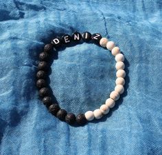 Personalized black & white bracelets, your name written on bracelet, lava stones can keep your favorite scent (perfume or aromatherapy oil). Pls mail send the name or one word message ( Luck, Joy, Peace...) and size of your desired bracelet length (Kids 6, Teen 6.5, Adult 7, 7.5, 8 inches). It is very nice gift alternative for birthday, coworker birthday, small team meeting, best friends, loved ones. Alphabet Bracelet, Custom Name Bracelet, Personalized Jewelry, Customized Gift, Personalized Gif Alphabet Bracelet, Coworkers Birthday, Scent Perfume, Bracelets Beads, White Bracelets, Aromatherapy Oils, Name Bracelet, Personalized Bracelets, One Word