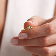 Your Green Emerald Stackable Ring is stylish, dainty and pretty ideal for everyday use. Details of solid gold handmade Minimalist Emerald Ring are very eye-catching. It is a great gift for your loved ones. This jewelry will be an indispensable piece of yours. This meaningful Emerald Jewelry with high quality handwork will be a legacy you can leave to your family its.  * Dainty Emerald Clover Ring Details * Material / Gold Kt:  14K (585), 18K (750), 8K (333) * Available Gold Colors: Yellow Gold, White Gold, Rose Gold * Band Width: 1.27 mm * Band Thickness: 1.27 mm * The width may differ slightly due to handwork. * Gemstone: AAA Grade Cz Emerald  * ABOUT PRODUCT Products with stones will be ready for dispatch within 3-5 business days, products without stones will be ready for dispatch within May Birthstone Rings, Clover Ring, Green Emerald Ring, Ring Emerald, Gold Colors, May Birthstone, Rose Gold Band, Ring Minimalist, Stackable Ring