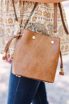 This bucket bag is the definition of chic and functional! The coloring is so trendy and we love the design! But or favorite part is the organization on the inside! It has spaces for all your cards so they don't get lost! Cheap Everyday Crossbody Bucket Bag, Trendy Bucket Hobo Bag For On-the-go, Versatile Bucket-shaped Bags For On-the-go, Trendy Bucket Satchel For On-the-go, Trendy Bags With Interior Card Slots For Everyday Use, Trendy Everyday Bags With Interior Card Slots, Trendy Crossbody Bag With Interior Card Slots, Bucket Shape Satchel With Removable Pouch For On-the-go, Trendy Pouch Shoulder Bag With Interior Card Slots