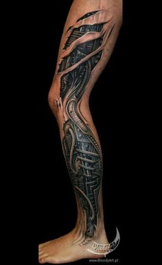 a man's leg with an intricate tattoo design on the calf and lower legs