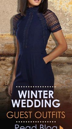 a woman standing in front of a stone wall wearing a blue dress with the words winter wedding guest outfits read blog