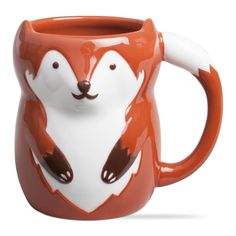 an orange and white mug with a fox face on it